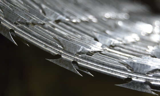 Concertina Razor Wire Creates Security Barrier To Protect Property