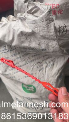 Red Plastic Support Clips That Go Between The Concertina Wire And The Wire